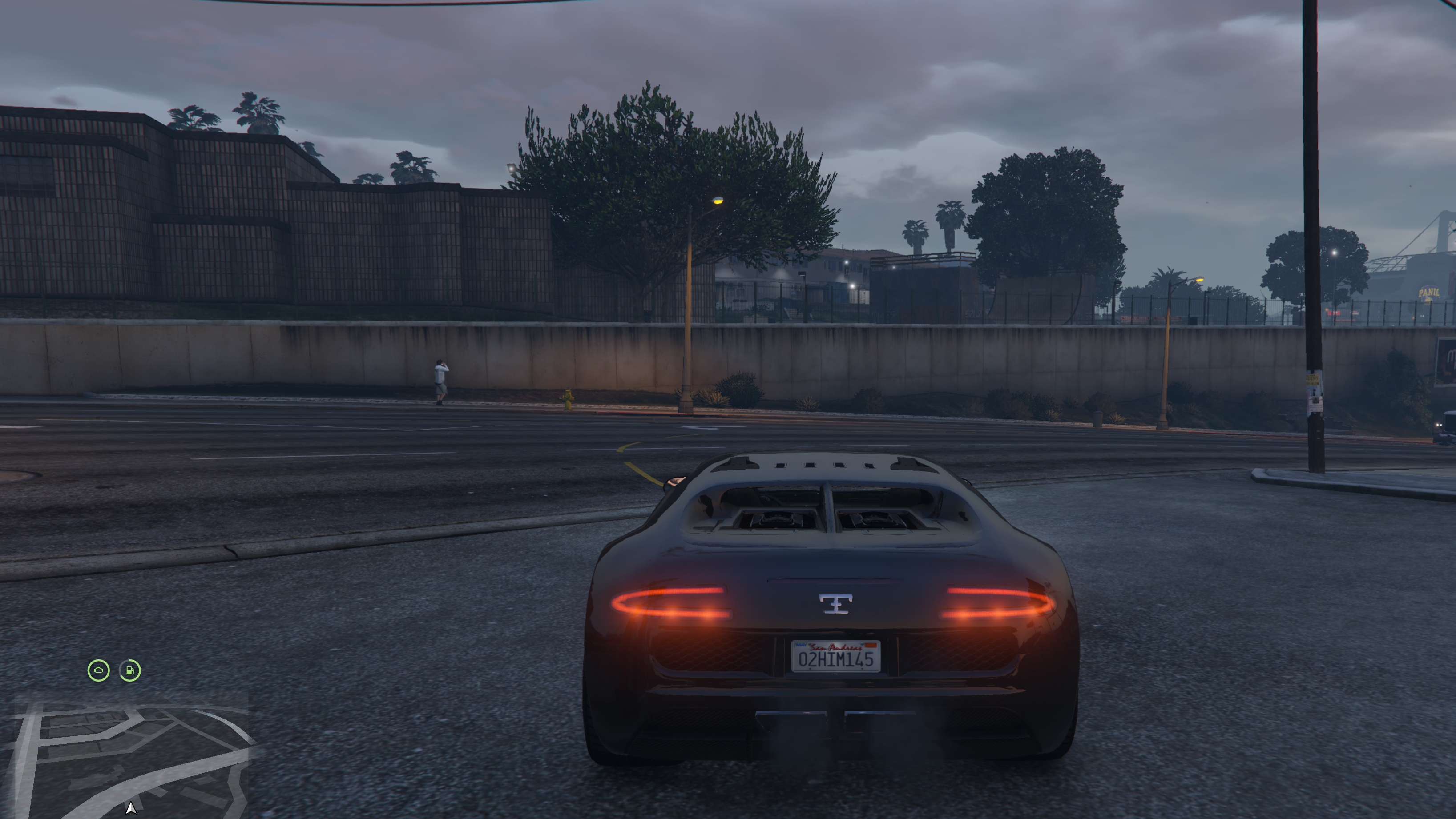GTA 6 style FiveM vehicle HUD circular engine and fuel icons above the minimap at night